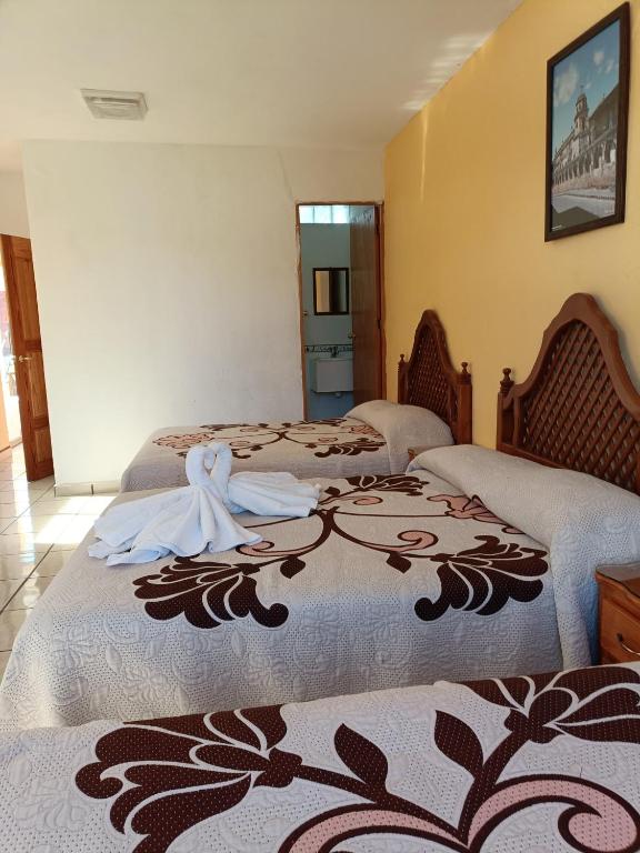 Postel nebo postele na pokoji v ubytování HOTEL CAMELINAS AREA BLANCA