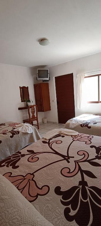 Postel nebo postele na pokoji v ubytování HOTEL CAMELINAS AREA BLANCA
