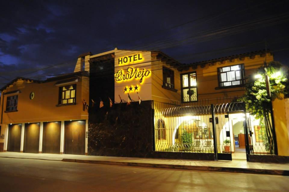 a hotel on a city street at night at Oro Viejo in Nazca