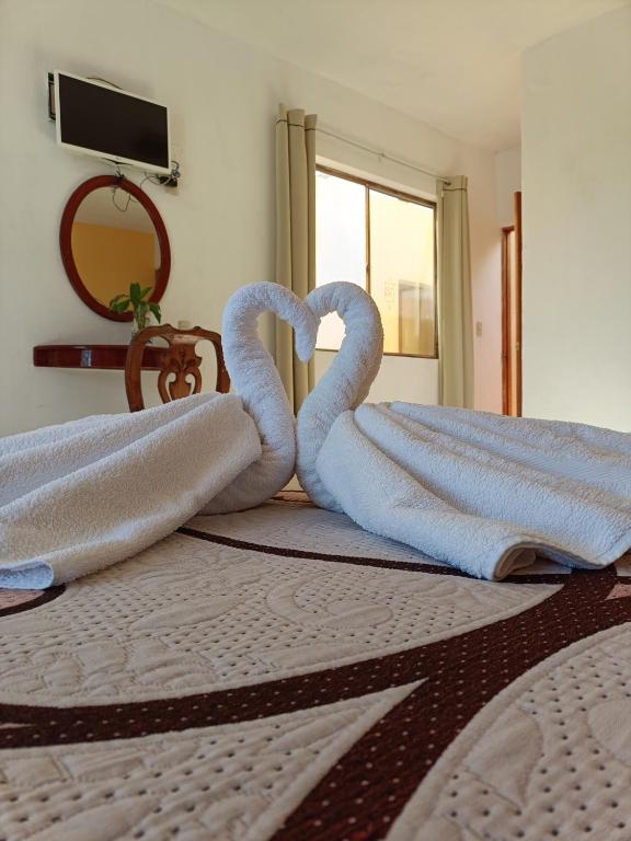 Postel nebo postele na pokoji v ubytování HOTEL CAMELINAS AREA BLANCA
