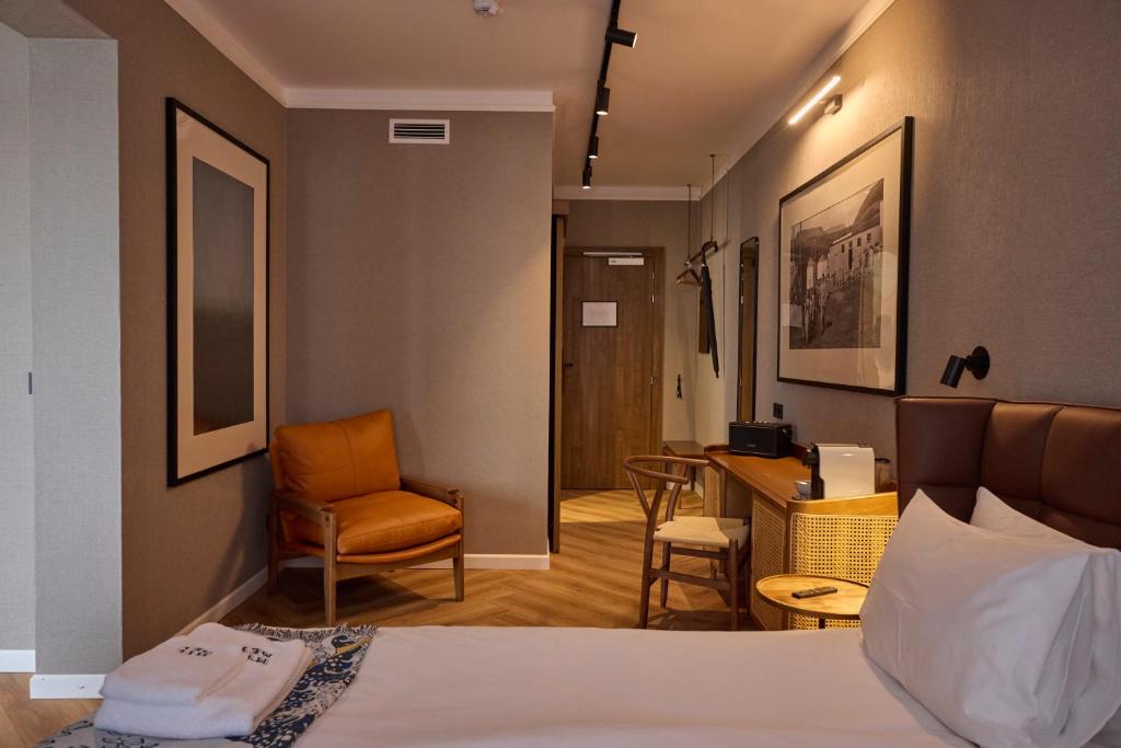 Postel nebo postele na pokoji v ubytování Hotel Akureyri