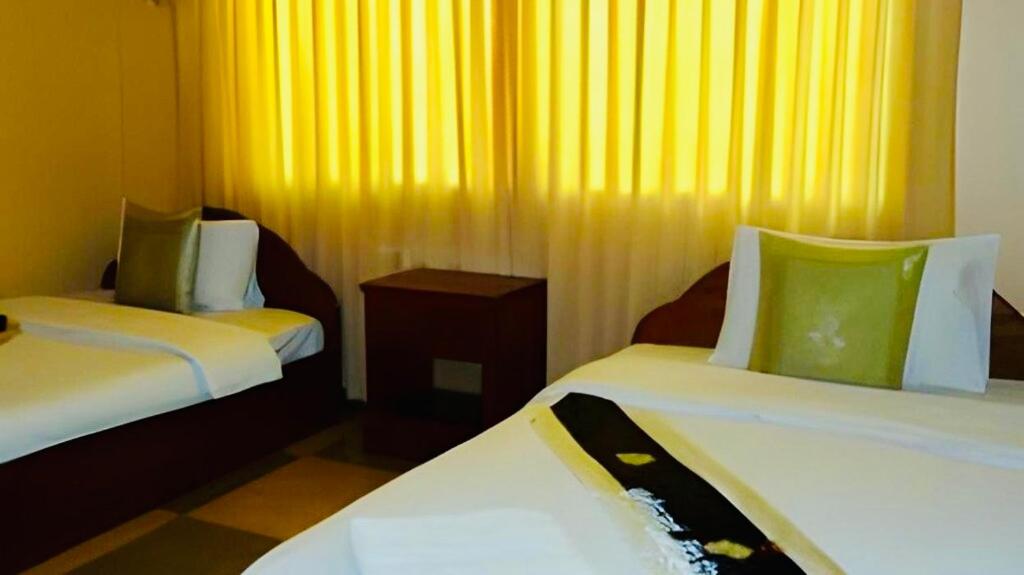 Postel nebo postele na pokoji v ubytování U Dara inn