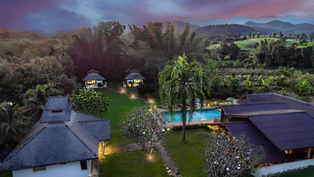an aerial view of a resort with a swimming pool at The Hideaway Village in Ban Mae Hi