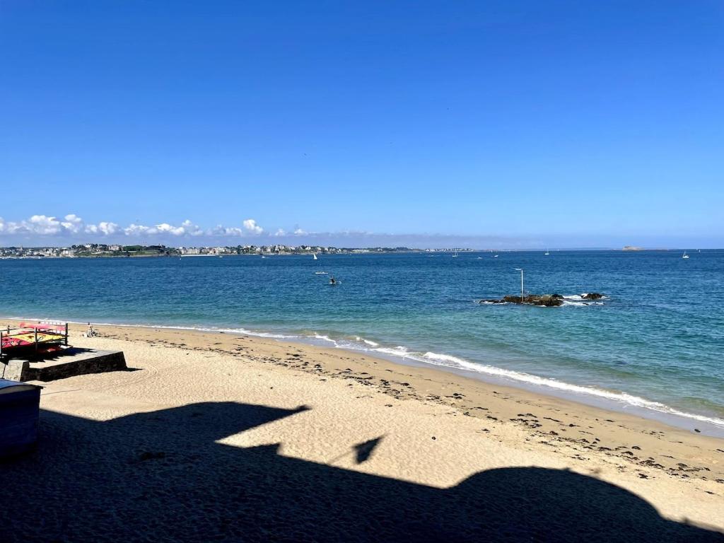 a shadow of a person on a beach at T2 dans l'intra-Muros VUE MER exceptionnelle in Saint Malo