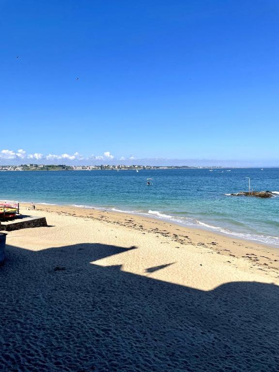 a shadow of a person on a beach at T2 dans l'intra-Muros VUE MER exceptionnelle in Saint Malo
