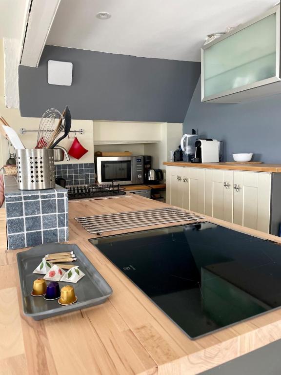 a kitchen with a large pool in the middle of it at T2 dans l'intra-Muros VUE MER exceptionnelle in Saint Malo