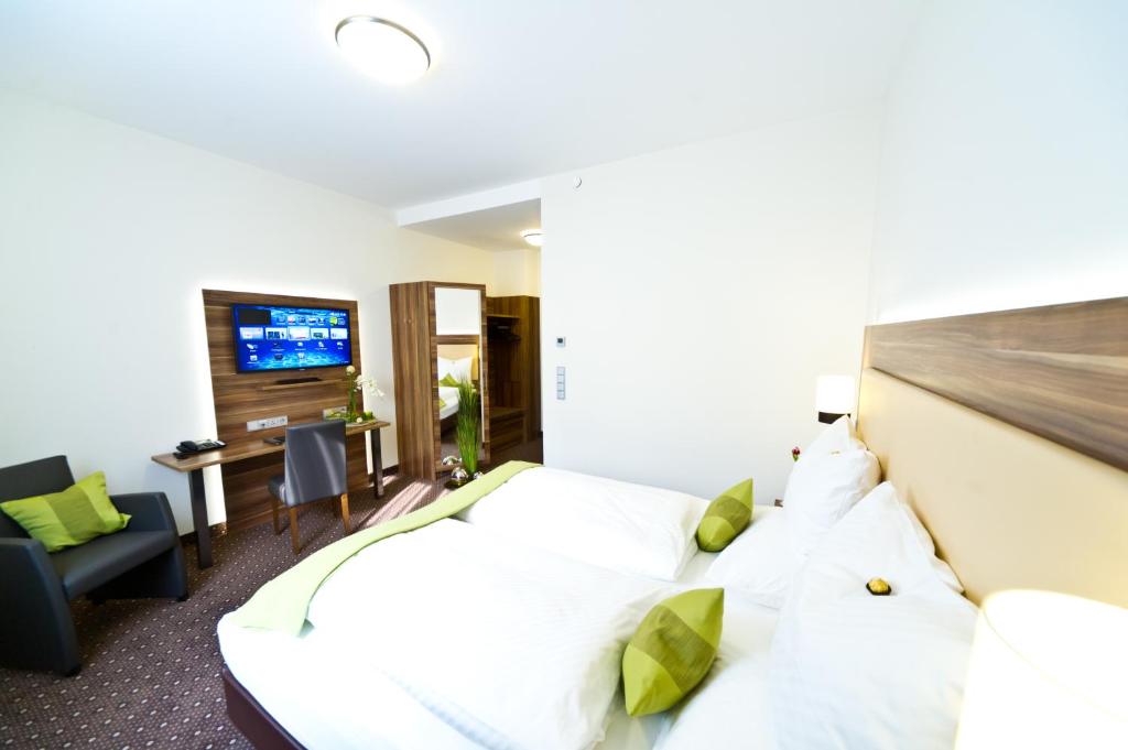 Postel nebo postele na pokoji v ubytování Wohlfühl-Hotel Neu Heidelberg