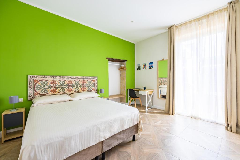 Postel nebo postele na pokoji v ubytování Terrazza Terzo Cardine