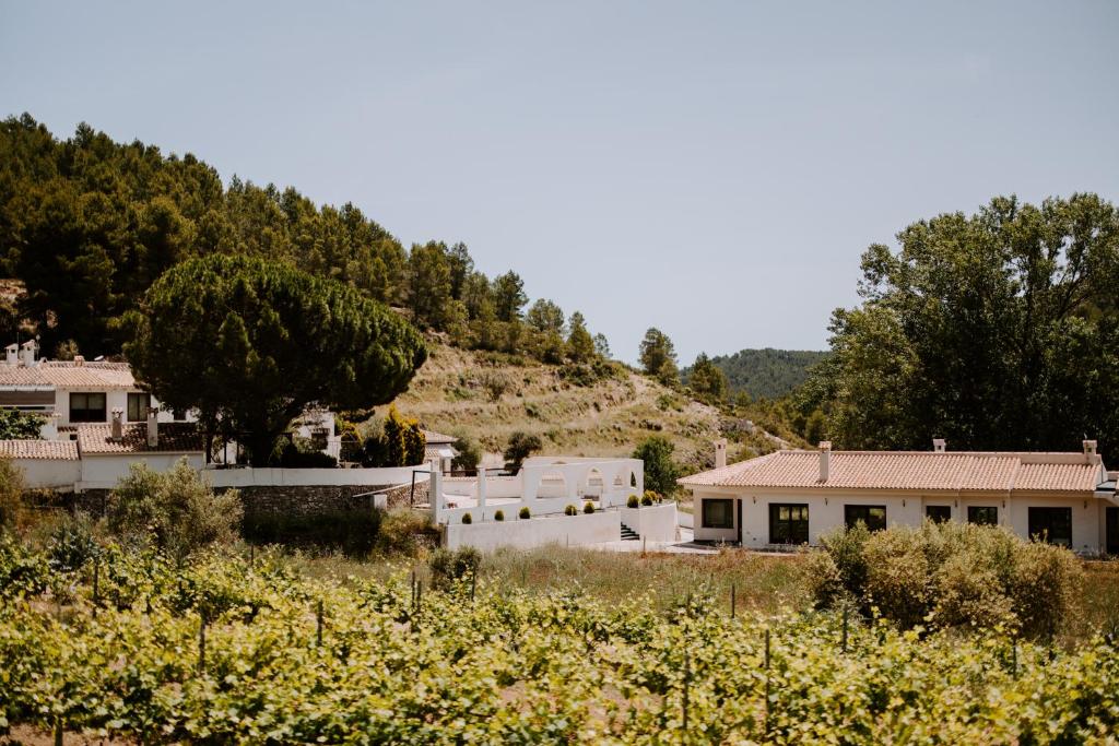 a cluster of white houses on a hill at Finca Seguró in Sella