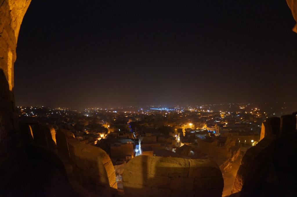 a view of a city at night at Hotel Garh Jaisal Haveli in Jaisalmer