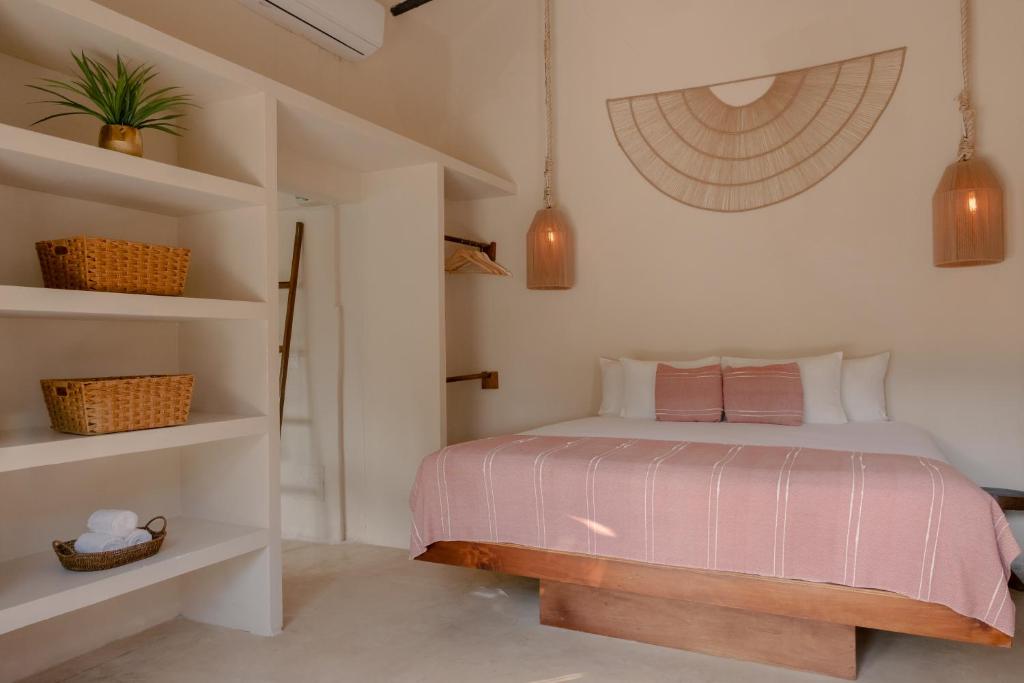 Postel nebo postele na pokoji v ubytování Alquimia Hotel Boutique