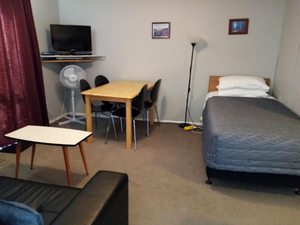 Postel nebo postele na pokoji v ubytování Mt Dobson Motel