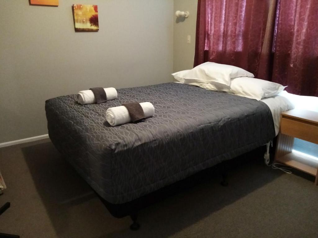 Postel nebo postele na pokoji v ubytování Mt Dobson Motel