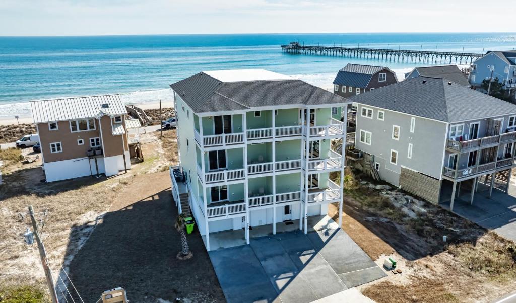 an aerial view of a house and the beach at Sandpipers and Sunshine by Sea Scape Properties in North Topsail Beach