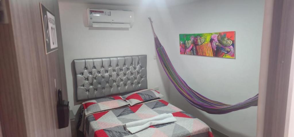 Postel nebo postele na pokoji v ubytování Apartaestudios Galanni