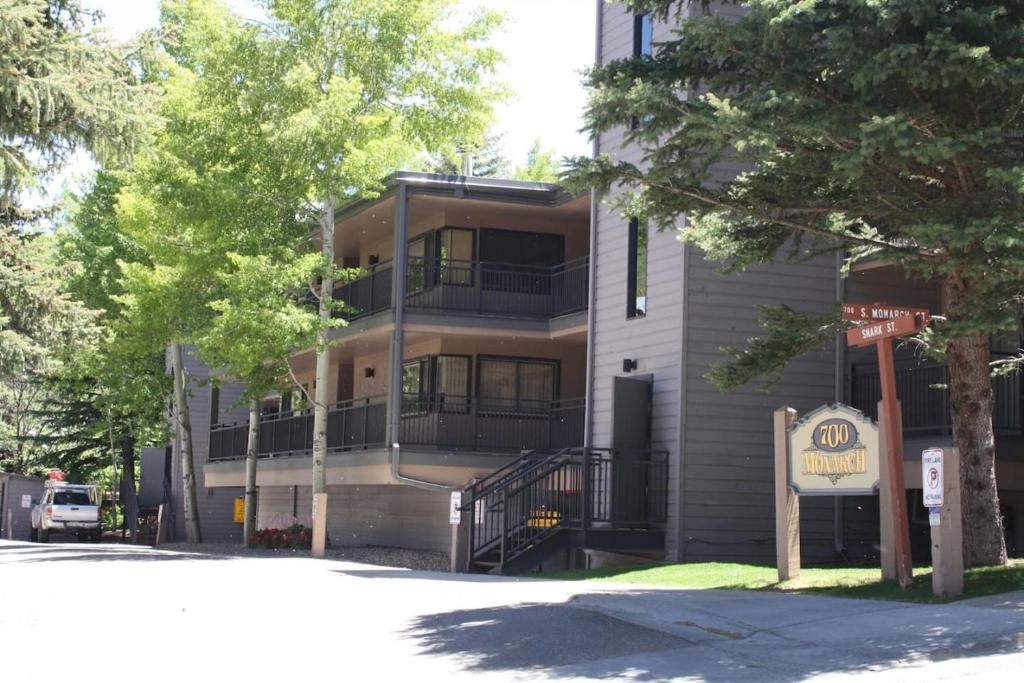 an apartment building with a staircase in front of it at Gorgeous Aspen Condo By Lift Ski In out Parking in Aspen
