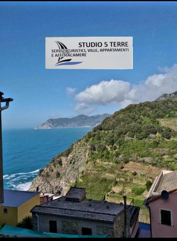 a view of the ocean and a mountain at La Casetta Rossa in Corniglia