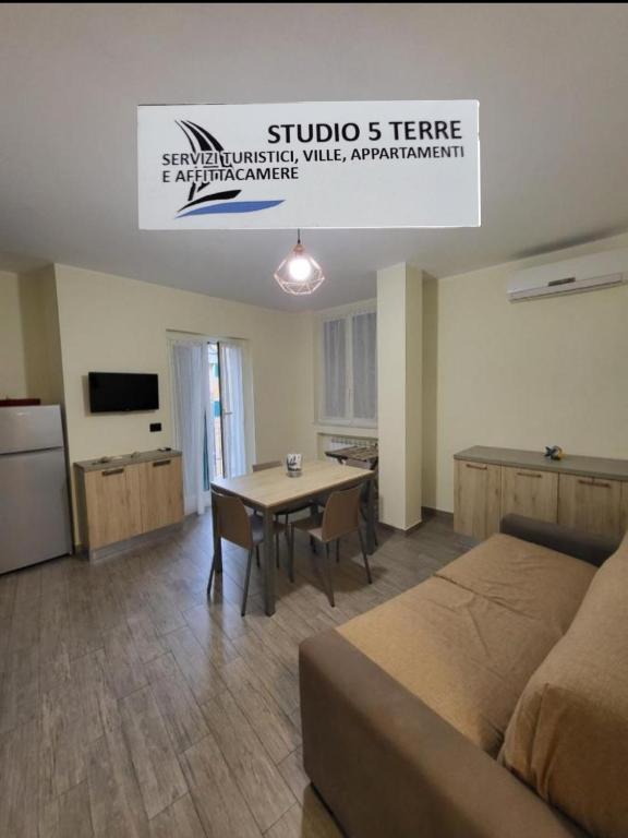 a living room with a couch and a table at Puppo Apartments in Corniglia