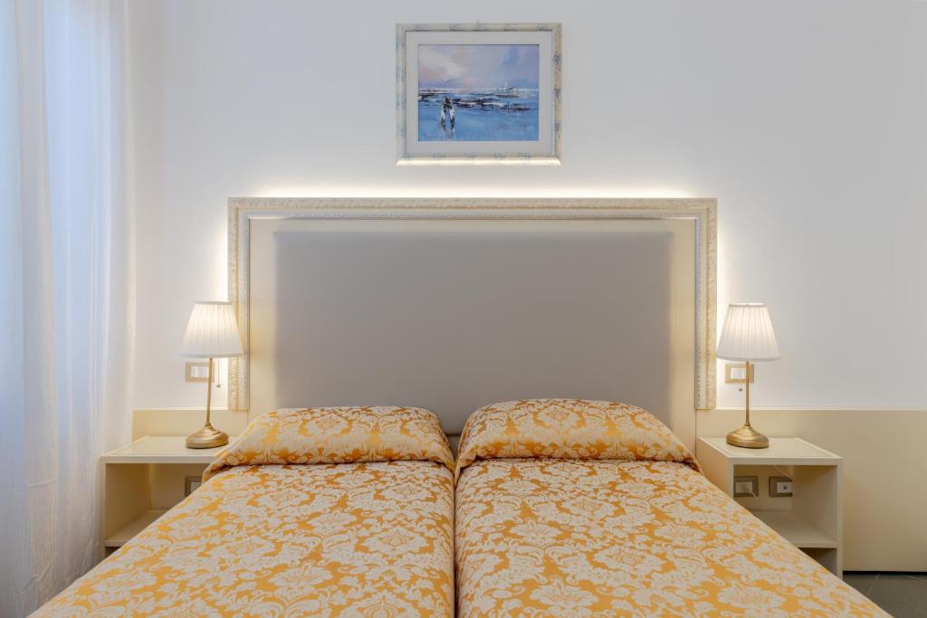 Posteľ alebo postele v izbe v ubytovaní Hotel Marte