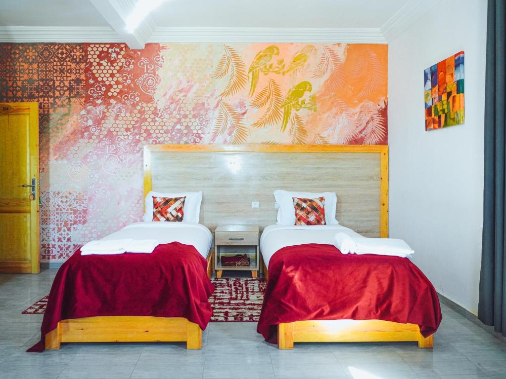 Postel nebo postele na pokoji v ubytování Fyndy Hotel Dakhla