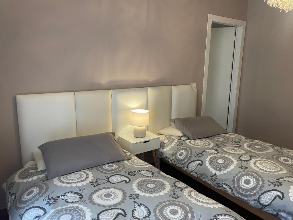 A bed or beds in a room at Bed & Breakfast con vista giardino e piscina
