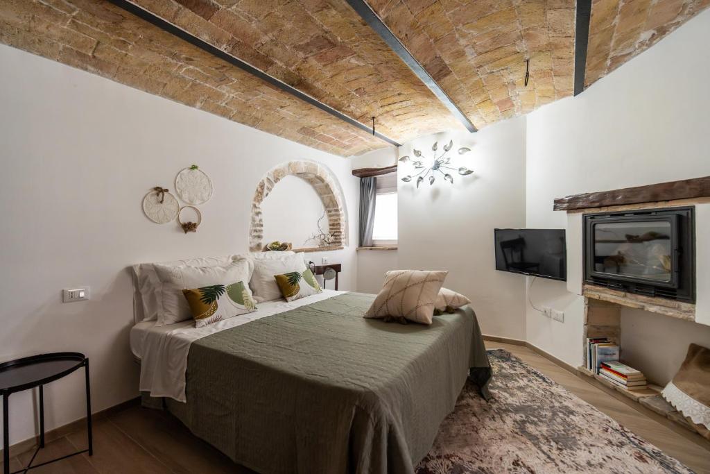Postel nebo postele na pokoji v ubytování Borgo del Piano "Alloggio Maria"