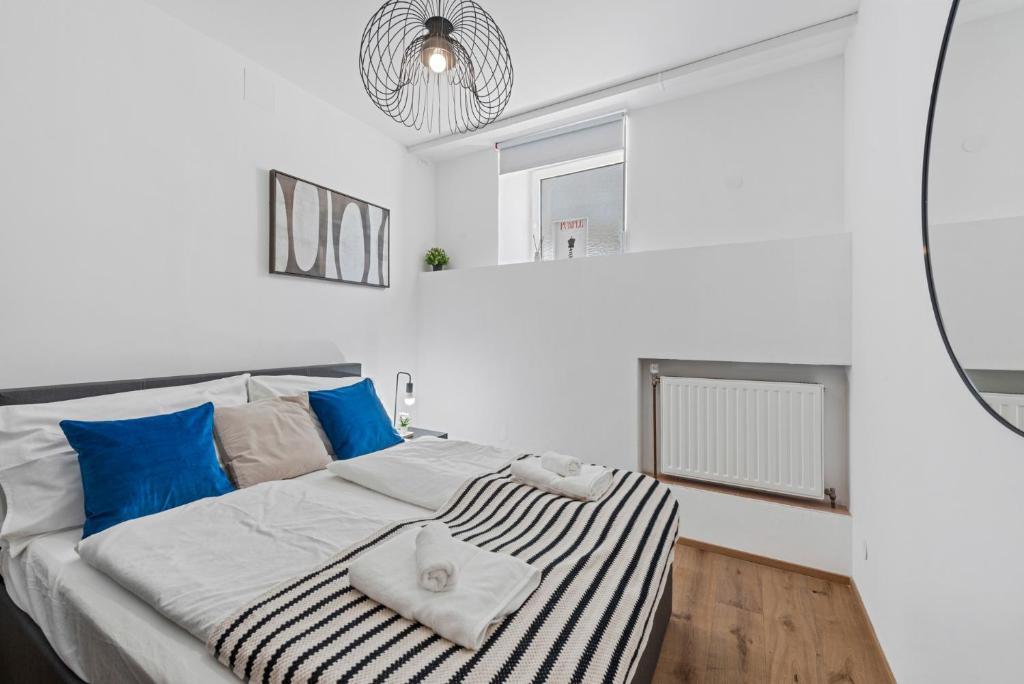 Postel nebo postele na pokoji v ubytování K22 Smart Rooms