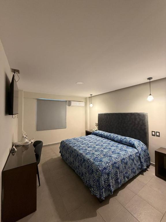 Postel nebo postele na pokoji v ubytování Hotel Impala Veracruz