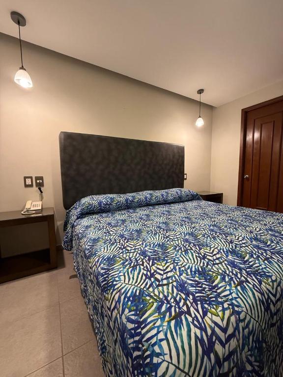 Postel nebo postele na pokoji v ubytování Hotel Impala Veracruz
