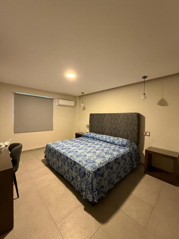 Postel nebo postele na pokoji v ubytování Hotel Impala Veracruz