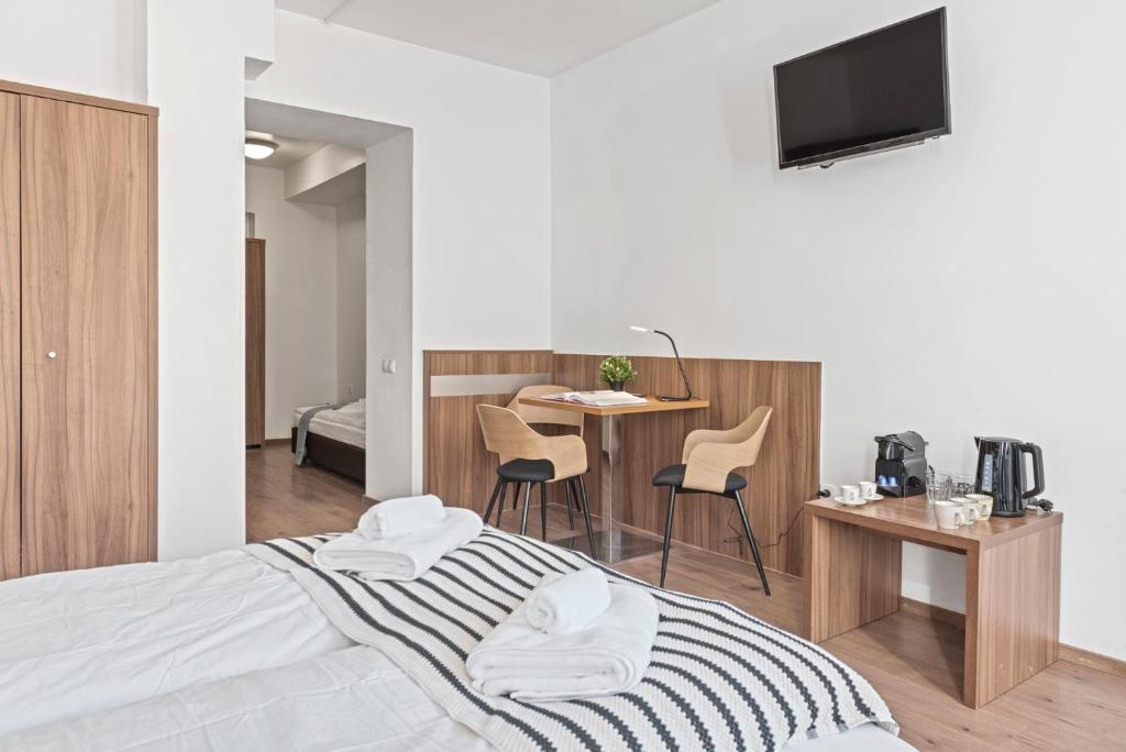 Postel nebo postele na pokoji v ubytování K22 Smart Rooms