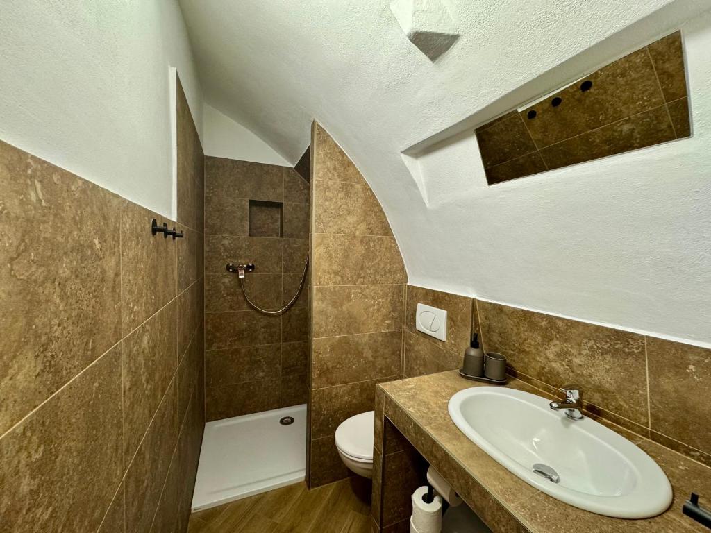 a bathroom with a sink and a toilet at Studio Nicolas II Prague in Prague