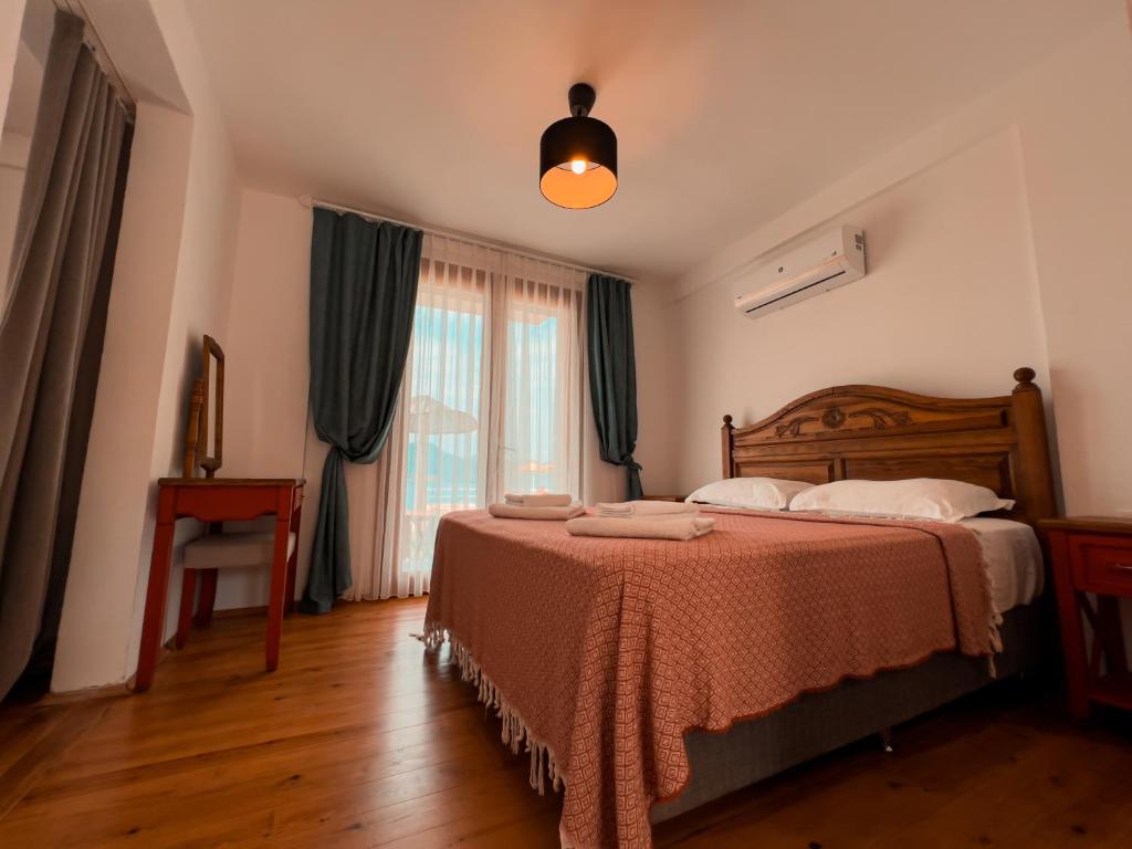 Postel nebo postele na pokoji v ubytování Alice Tatil Evi