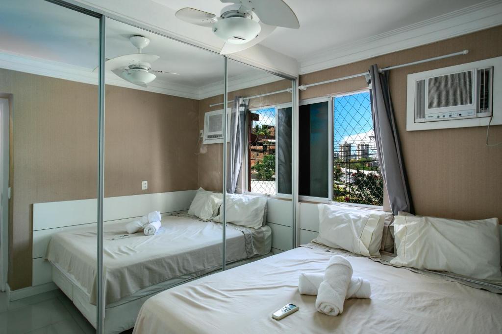 En eller flere senge i et værelse på Casa cores, 2 quartos, piscina