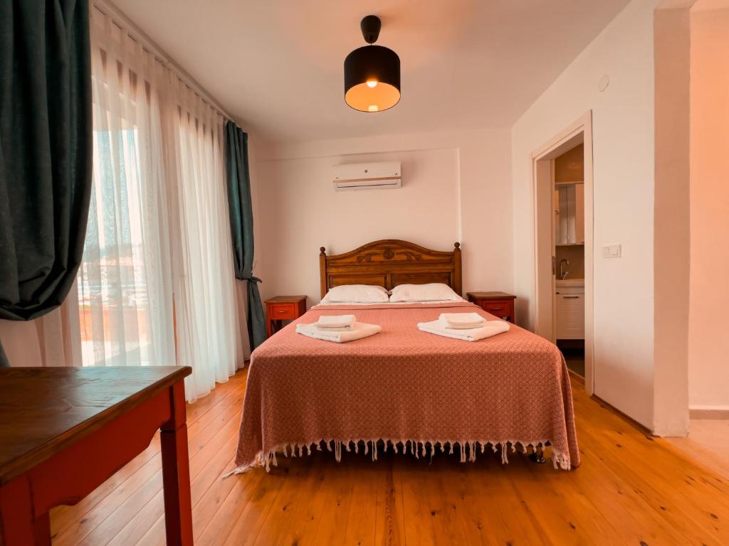Postel nebo postele na pokoji v ubytování Alice Tatil Evi