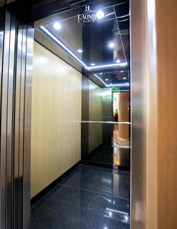 a hallway with a elevator in a building at La Onda Hotel Durres in Durrës