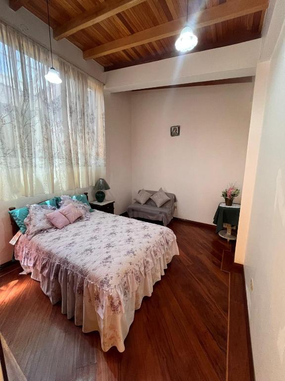 Postel nebo postele na pokoji v ubytování La Casa Ambateña