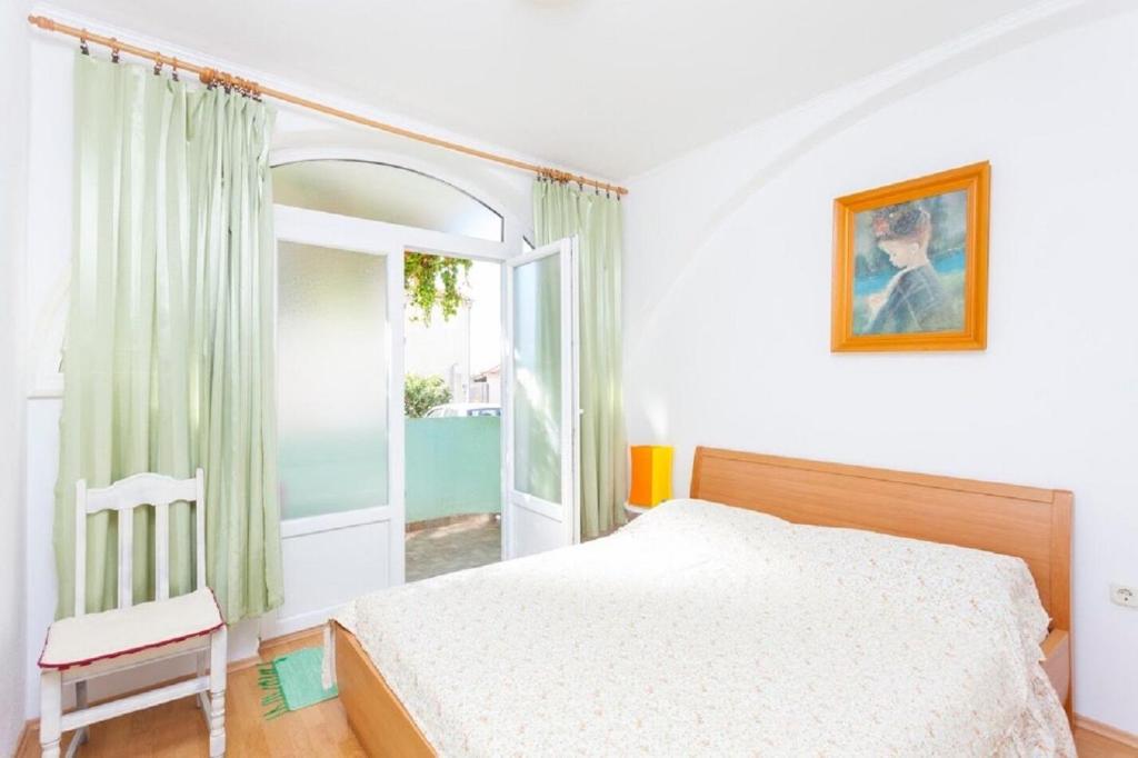 Posteľ alebo postele v izbe v ubytovaní Apartments Tomislava