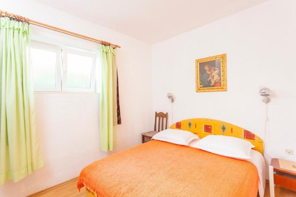 Posteľ alebo postele v izbe v ubytovaní Apartments Tomislava