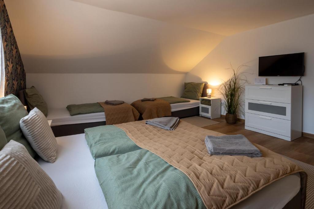 Postel nebo postele na pokoji v ubytování RP Apartmanház