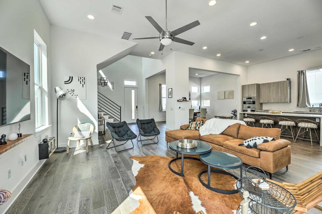 a living room with a couch and a table at Agave Luxe Home - 8 Mi to Downtown in Austin