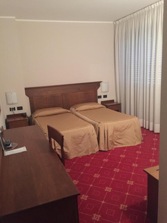 Łóżko lub łóżka w pokoju w obiekcie La Pina