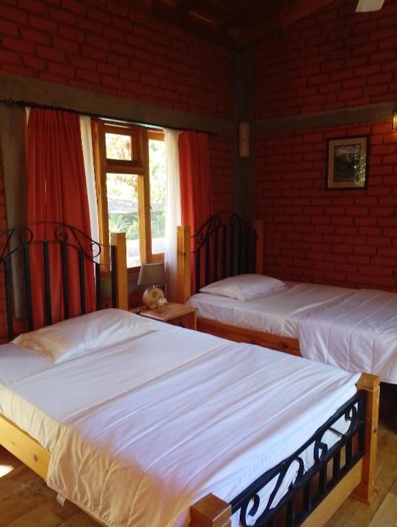 Postel nebo postele na pokoji v ubytování Tea Leaf Retreat