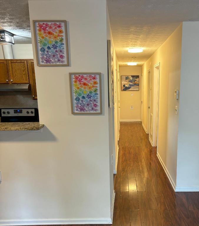 a hallway of a home with two paintings on the wall at Atlanta Charming Private Room 1 in Atlanta