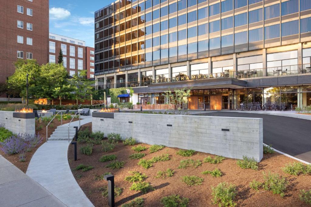 a large building with a courtyard in front of it at Hotel Champlain Burlington, Curio Collection by Hilton in Burlington
