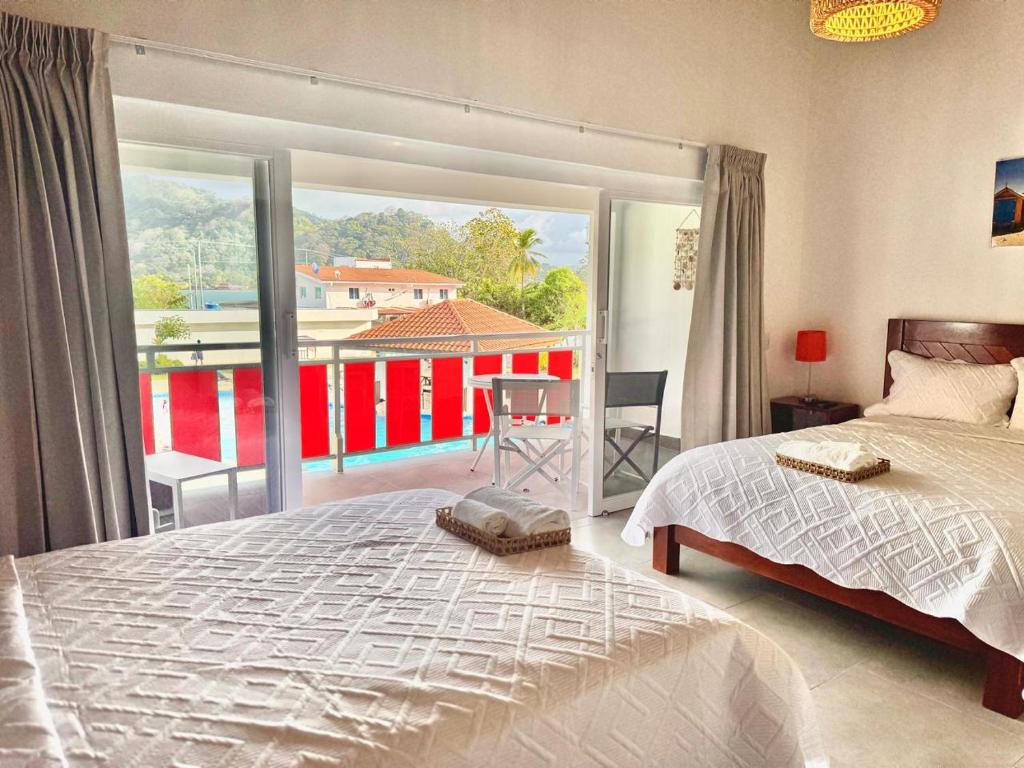 Postel nebo postele na pokoji v ubytování Hotel Candy Rose
