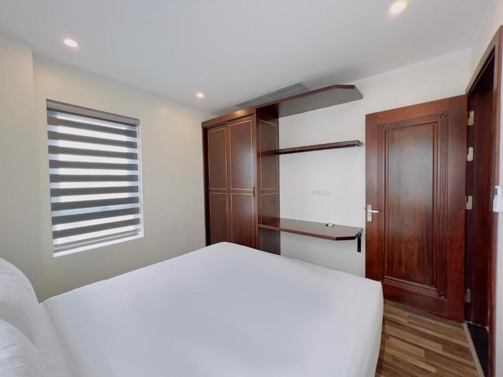 Postel nebo postele na pokoji v ubytování Hanoi Apartment
