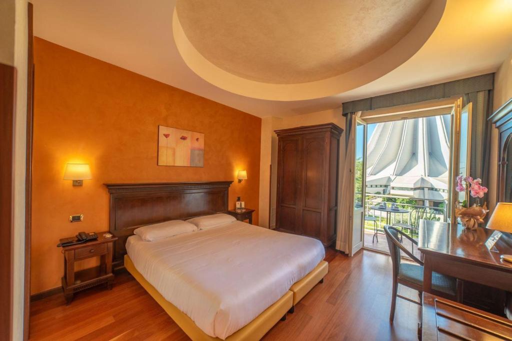 Postel nebo postele na pokoji v ubytování Hotel Teocrito