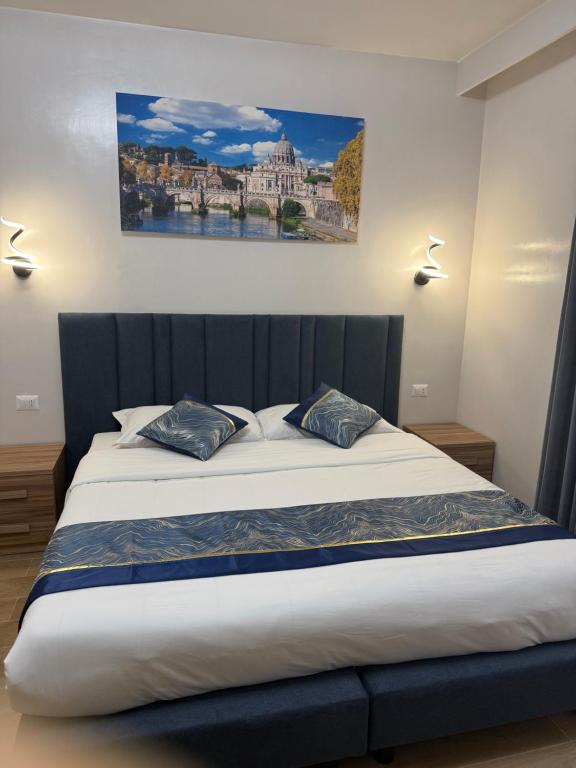 a bedroom with a large bed with two pillows at Vatican Bliss in Rome