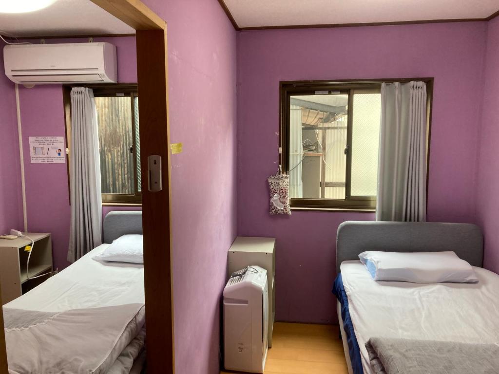 Postel nebo postele na pokoji v ubytování Hostel Blue Door ホステル ブルードア